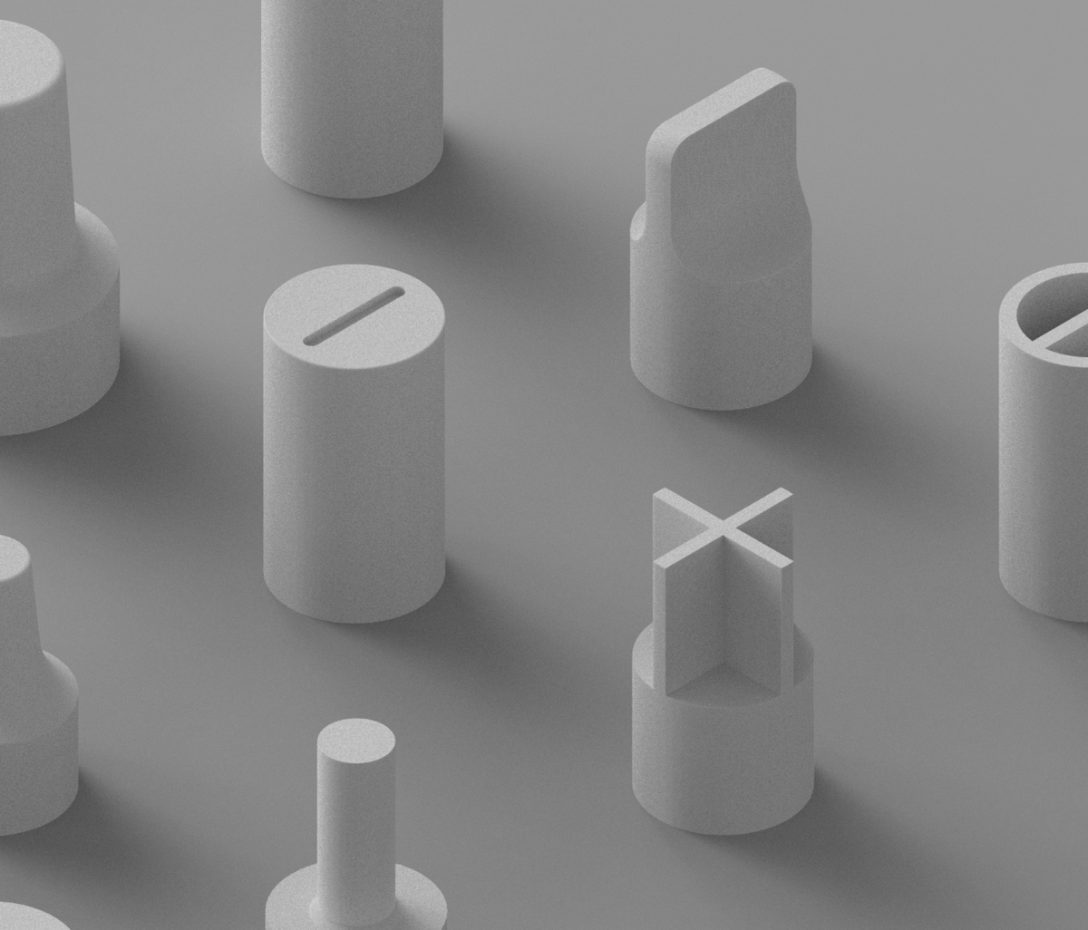 The image shows a collection of various gray objects with different shapes and sizes, arranged in a grid-like pattern.